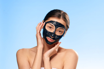Problem with skin, woman in cosmetic mask on blue background