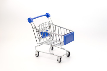 mini supermarket shopping cart blue color on white background, holiday sale and online shopping concept, selective focus, copy space