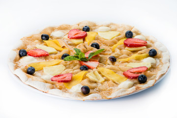 Delicious pizza pie with strawberries and pineapple