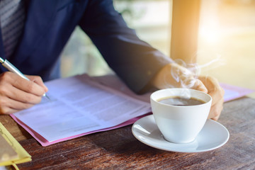 coffee cup clock and work on table