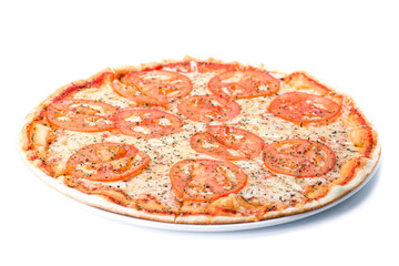 Italian margarrita pizza with tomatoes on plate