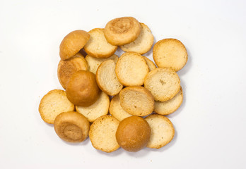 French toast, biscuits, dried bread on white background