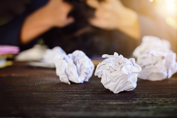 Businessmen stress and Fear Crushed paper on wood table