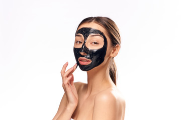 Woman in cosmetic mask on isolated background portrait