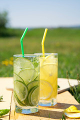 Two glasses of lemonade and lime in the open air.