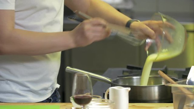 Chef man cooking healhy omlette in a restaurant kitchen