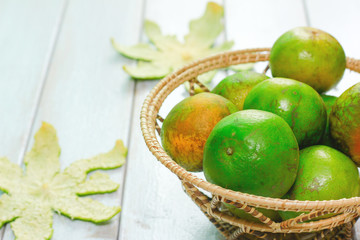 Stock Photo - Orange fruit on a wooden white.