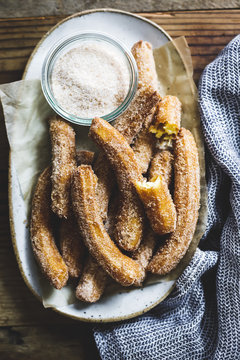 A churro, a fried dough sweet pastry based snack.