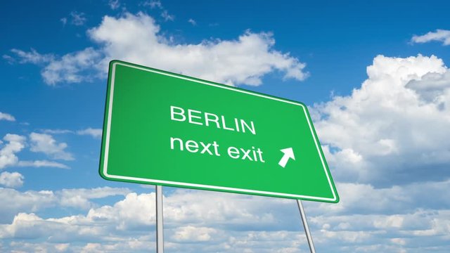 Animated road sign (Berlin), with a time lapsed sky as backdrop. 