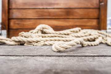 Fototapeta na wymiar Rope lying on the wooden deck of a yacht.