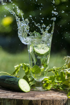 Glass with mineral water with cucumber and mint