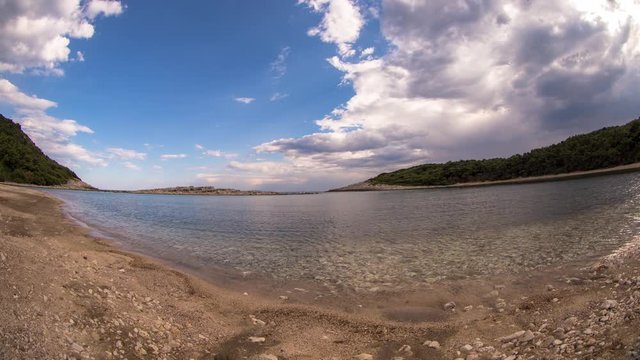 timelapse of a wooden shack on beautiful limoni beach in mljet island, croatia with stunning crystal clear water of the adriatic sea.