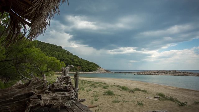 timelapse of a wooden shack on beautiful limoni beach in mljet island, croatia with stunning crystal clear water of the adriatic sea.