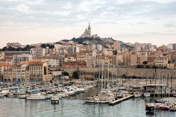 Aerial view on basilica of Notre Dame de la Garde and old port in Marseille