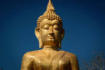 Golden Buddha statue in Buddhist  temple or wat, is public domain or treasure of Buddhism. (Shot at outdoor ,public area)