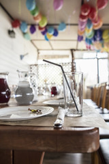 Preparation of banquet tables and café premises for children's party.