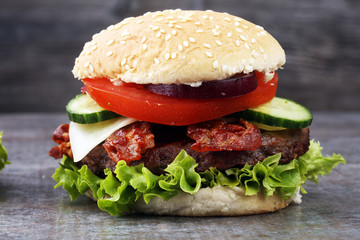 fresh tasty burger on wooden grey background