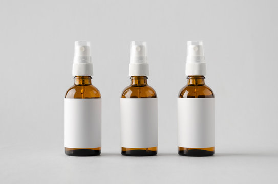 Amber Spray Bottle Mock-Up - Three Bottles. Blank Label