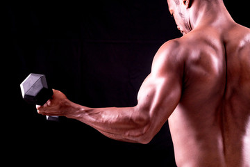 Obraz na płótnie Canvas man big muscles doing exercises