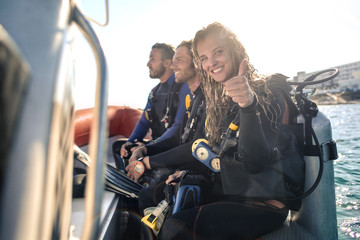 Group of scuba divers on a boat
