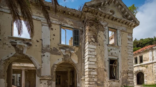 timelapse of a bombed out half destroyed building close to Dubrovnik that was attacked during the balkan conflict
