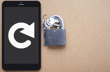 Reload Security Tablet Computer Web Template Concept on Wooden Background. Lock keys and circular...