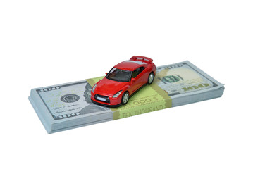 a red car and money isolated on whute background
