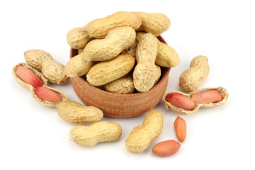 peanuts in wood plate isolated on the white background