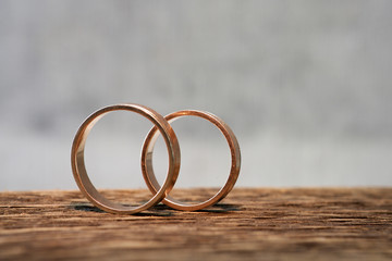 wedding rings on wood