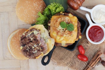 Double hamburger with double cheese is tasty.