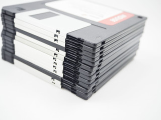 Stack of old storage, diskette, floppy disk on white background