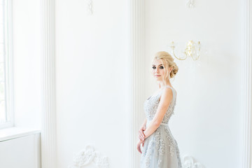 Fashion bride in gray dress with make-up smoky eyes