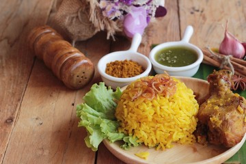 chicken biryani with rice delicious and sauce.