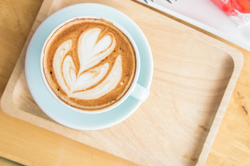 coffee heart cup on wood table in coffe shop cafe