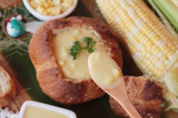 Corn soup in bread bowl with fresh corn