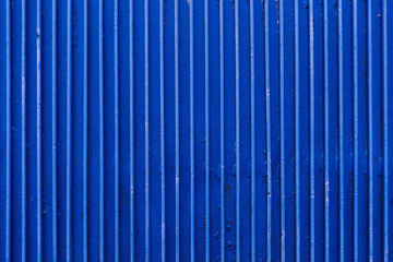 old blue painted metal ribbed surface