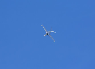 Fouga Magister vintage airplane flying against a blue sky.