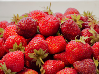 The harvest of the strawberry. Lots of red berries.
