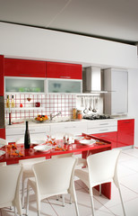 home interior shot of clean modern red kitchen desing