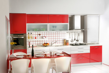 home interior shot of clean modern red kitchen desing