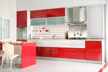home interior shot of clean modern red kitchen desing