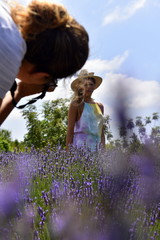 photographer and model in lavender field 