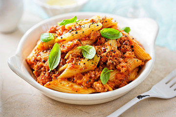 Italian tuscan sausage penne in tomato sauce with basil 
