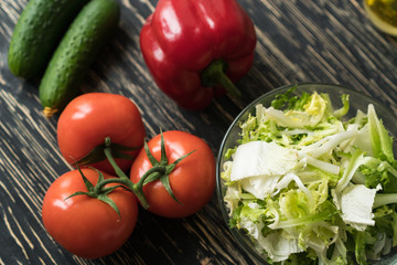 Salad ingridients. Tomato, lettuce, paprika and cucumber.