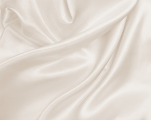 Fototapeta premium Smooth elegant golden silk or satin luxury cloth texture as wedding background. Luxurious background design. In Sepia toned. Retro style
