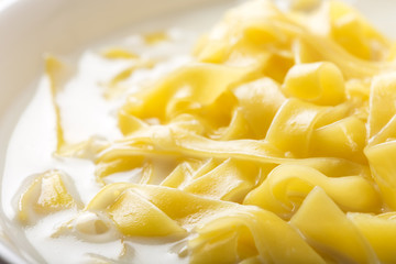 Close up of noodles (tagliatelle) with milk