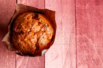 Chocolate muffins in the dark paper.