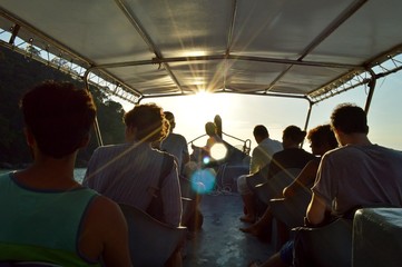 A group of friends sail on a boat trip on an excursion