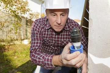 electrician builder engineer worker testing electronics