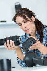 professional photographer assembling camera